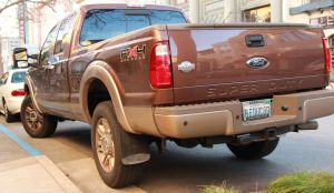 Here's a little piece of Americana, a giant gas guzzler truck (on city streets) with the license plate "B educ8d".