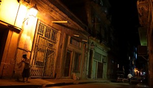 Havana sidestreet at night with woman