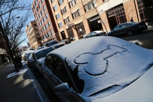 Penis drawing in the snow on a Chicago windshield