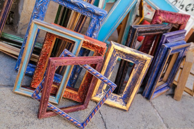 Picture frames on a Venetian sidewalk