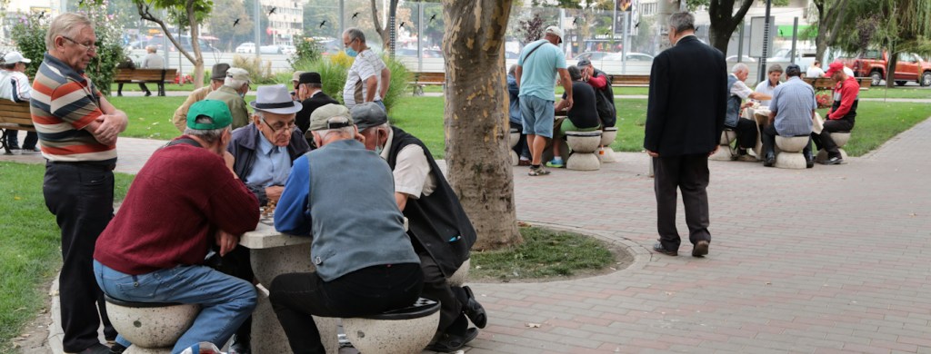Men playing chess and dominos in Iasi, Romania