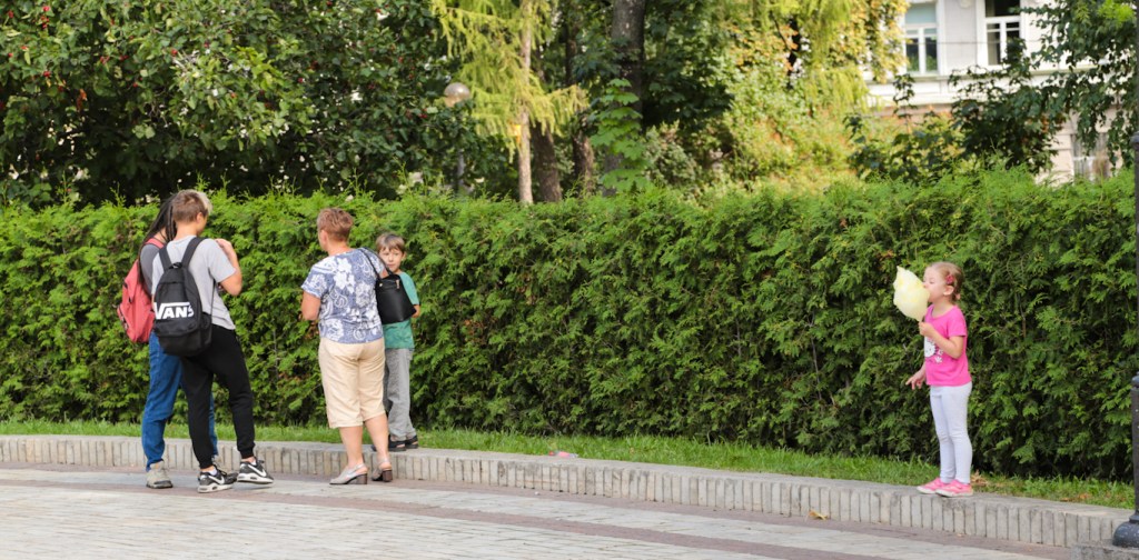 Kids playing and eating cotton candy in a park in Kiev, Ukraine, Kyiv
