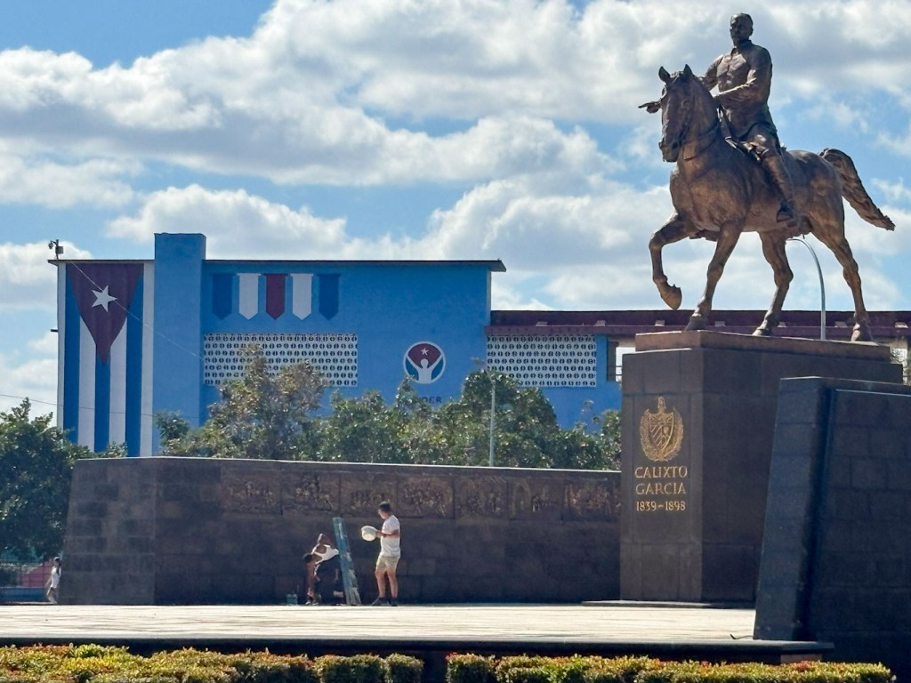Equestrian statue of Calixto Garcia, Cuban hero, in Havana Cuba, with flag in background